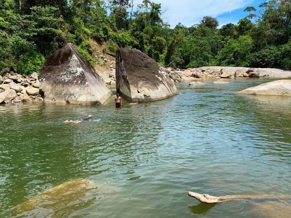 sacred lagoon with a split stone, visit during feather crown ayahuasca retreat in ecuador