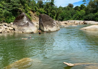 sacred lagoon with a split stone, visit during feather crown ayahuasca retreat in ecuador